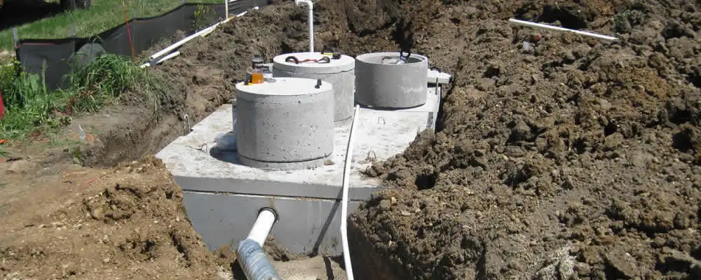 Septic system repair and installation site with tank access ports in Charlotte, NC
