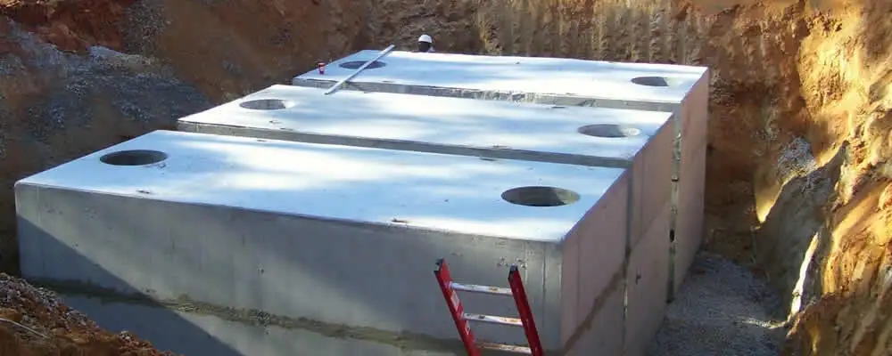 Septic tank installation site with a newly placed concrete tank in Charlotte, NC